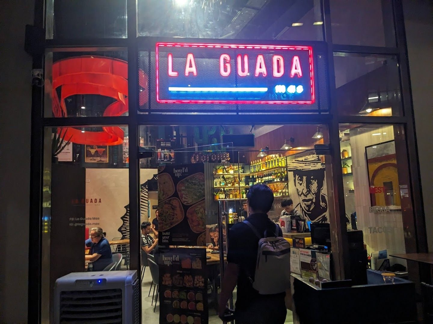 La Guada Mas Rockwell branch entrance with neon sign